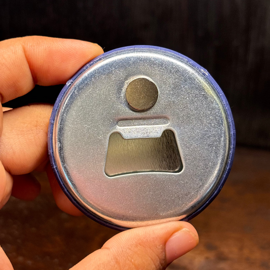 A 2-in-1 bottle-opener and a fridge magnet with sturdy metal body, by Curious Letters.