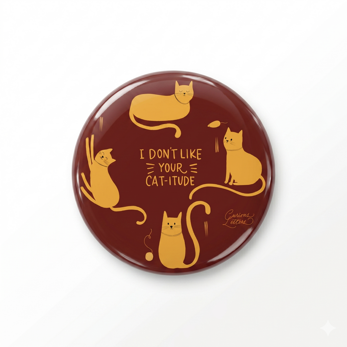 A 2-in-1 "Cat-itude" bottle-opener and fridge magnet, with cats with attitude, for cat lovers, art by Curious Letters. 58 mm diameter and sturdy metal body. 